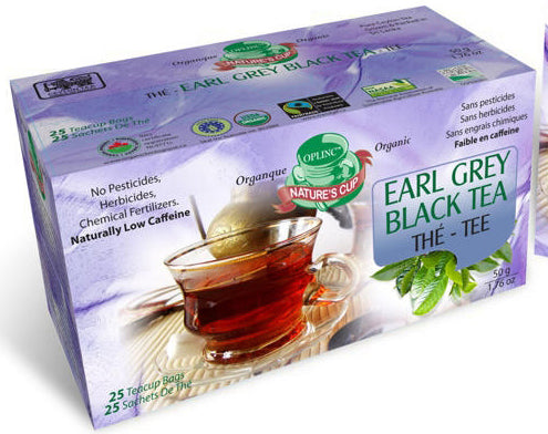 Box of Earl Grey Black Tea with 25 string and tag enveloped tea sachets a glass of tea on a white background. Tea is organic certified.